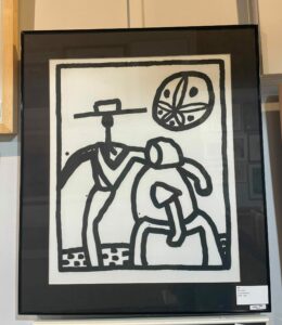 Keith Haring's "Kutz Town" print in frame.